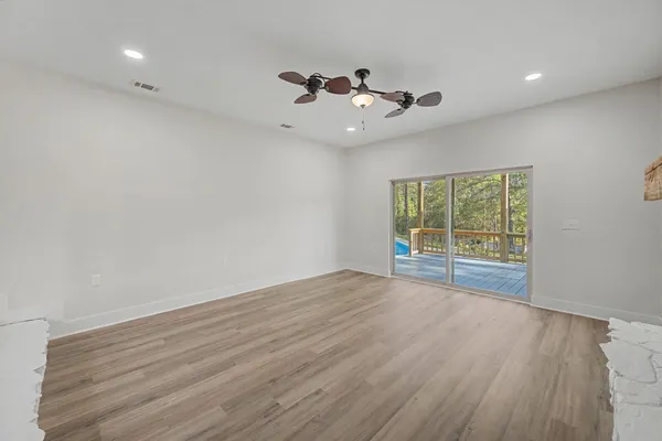 a view of entryway with wooden floor and a front door