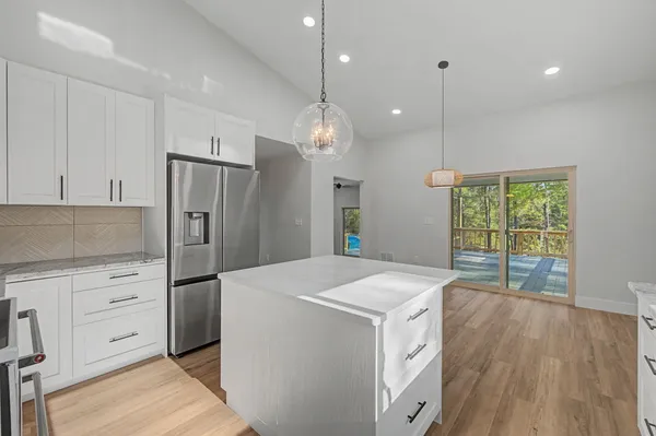 a view of a house with swimming pool and a yard