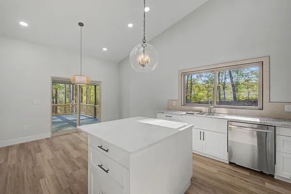 a view of balcony with wooden floor
