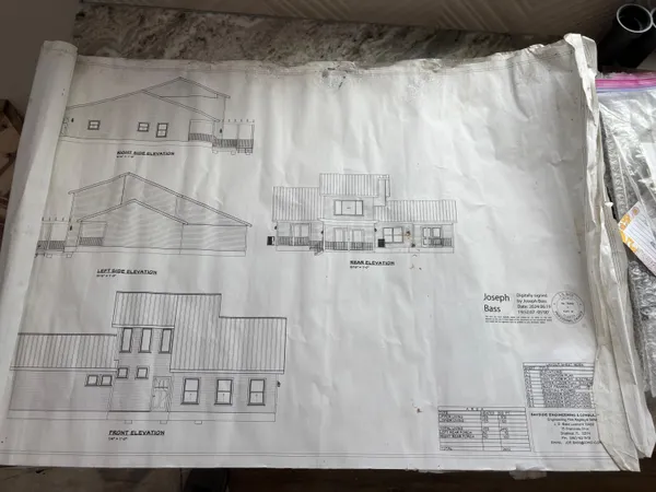 a kitchen with a refrigerator a sink and dishwasher a oven with wooden floor