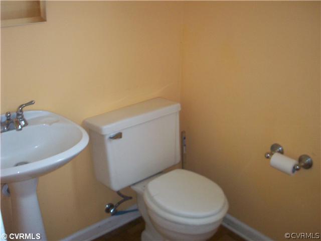 5614 Grubby Road Wilsons, VA 23894 - Photo 8 of 18 a bathroom with a sink and a toilet