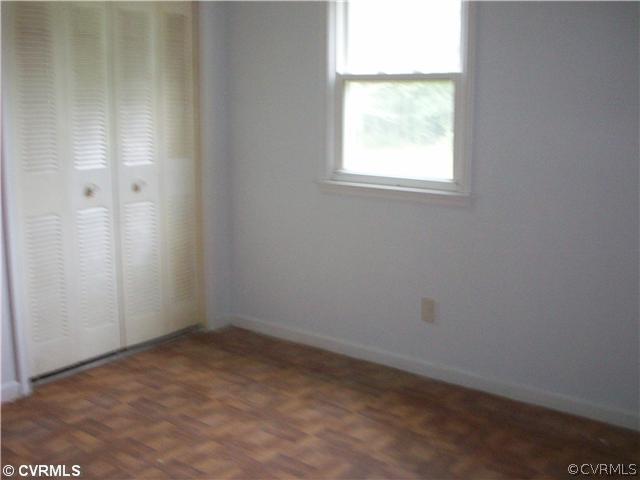 5614 Grubby Road Wilsons, VA 23894 - Photo 9 of 18 an empty room with a window