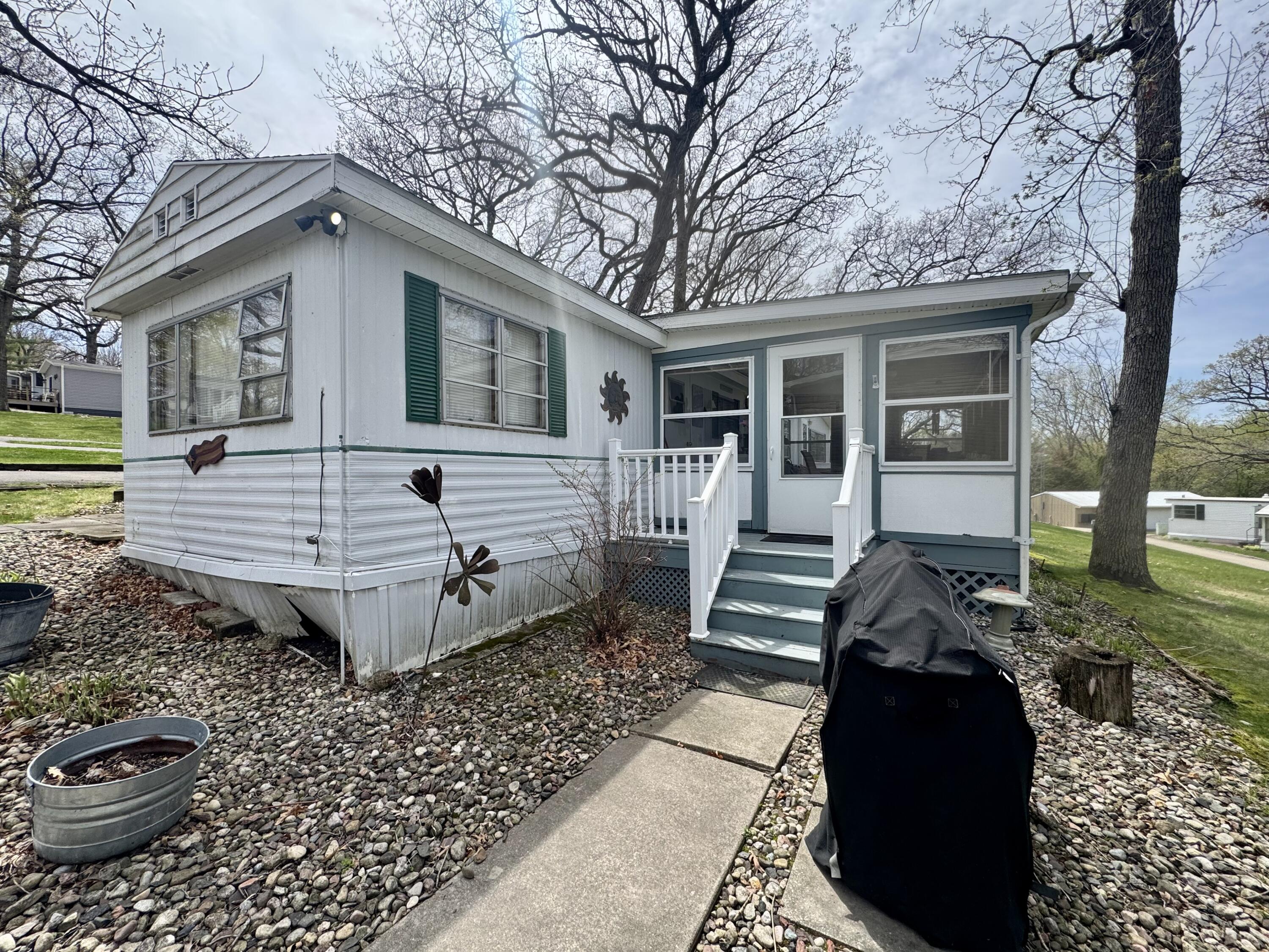 W1325 Spring Grove Road, Unit 39 Ripon, WI 54971 - Photo 5 of 28 Enter into the screened porch