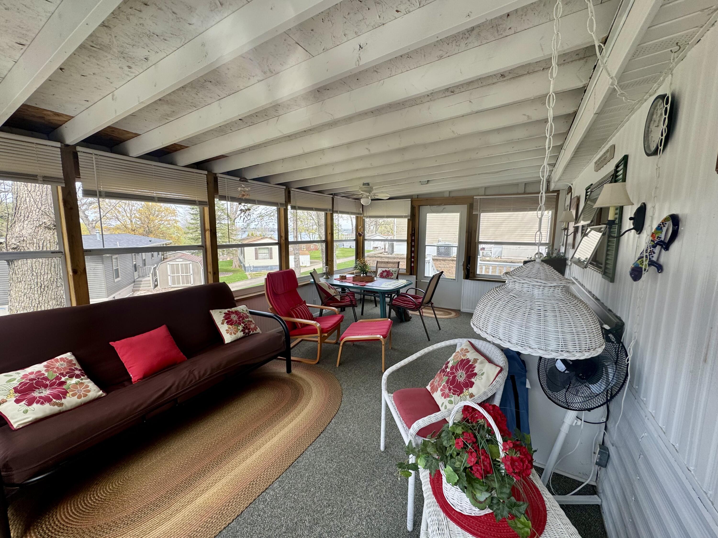 W1325 Spring Grove Road, Unit 39 Ripon, WI 54971 - Photo 6 of 28 Screened porch for relaxing