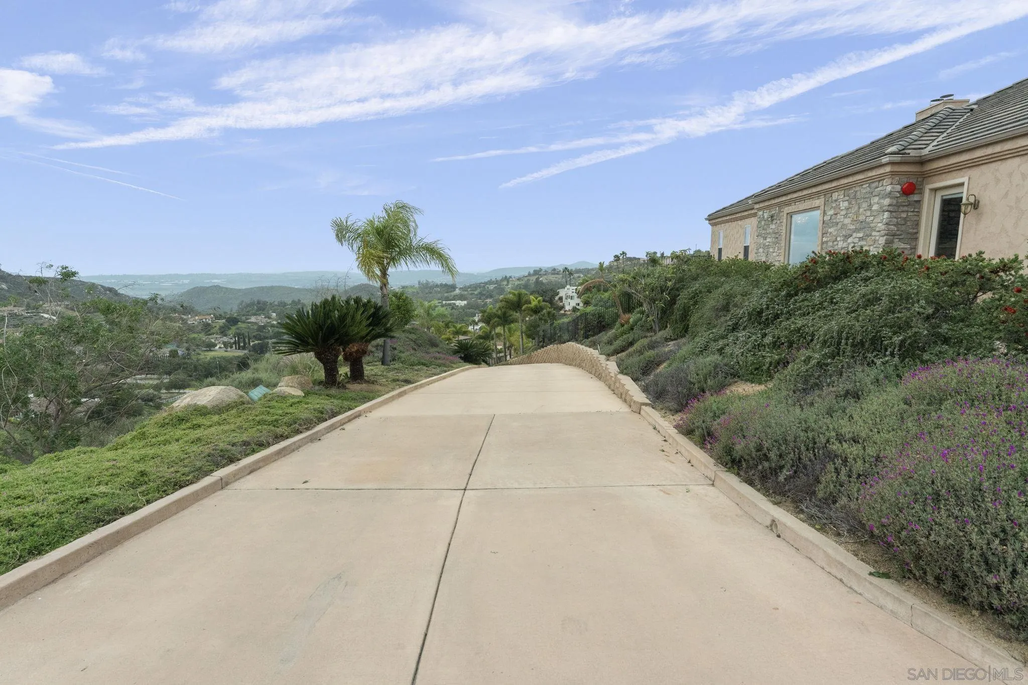 15480 Eastvale Road Poway, CA 92064 - Photo 29 of 71 a view of a garden with a building in the background