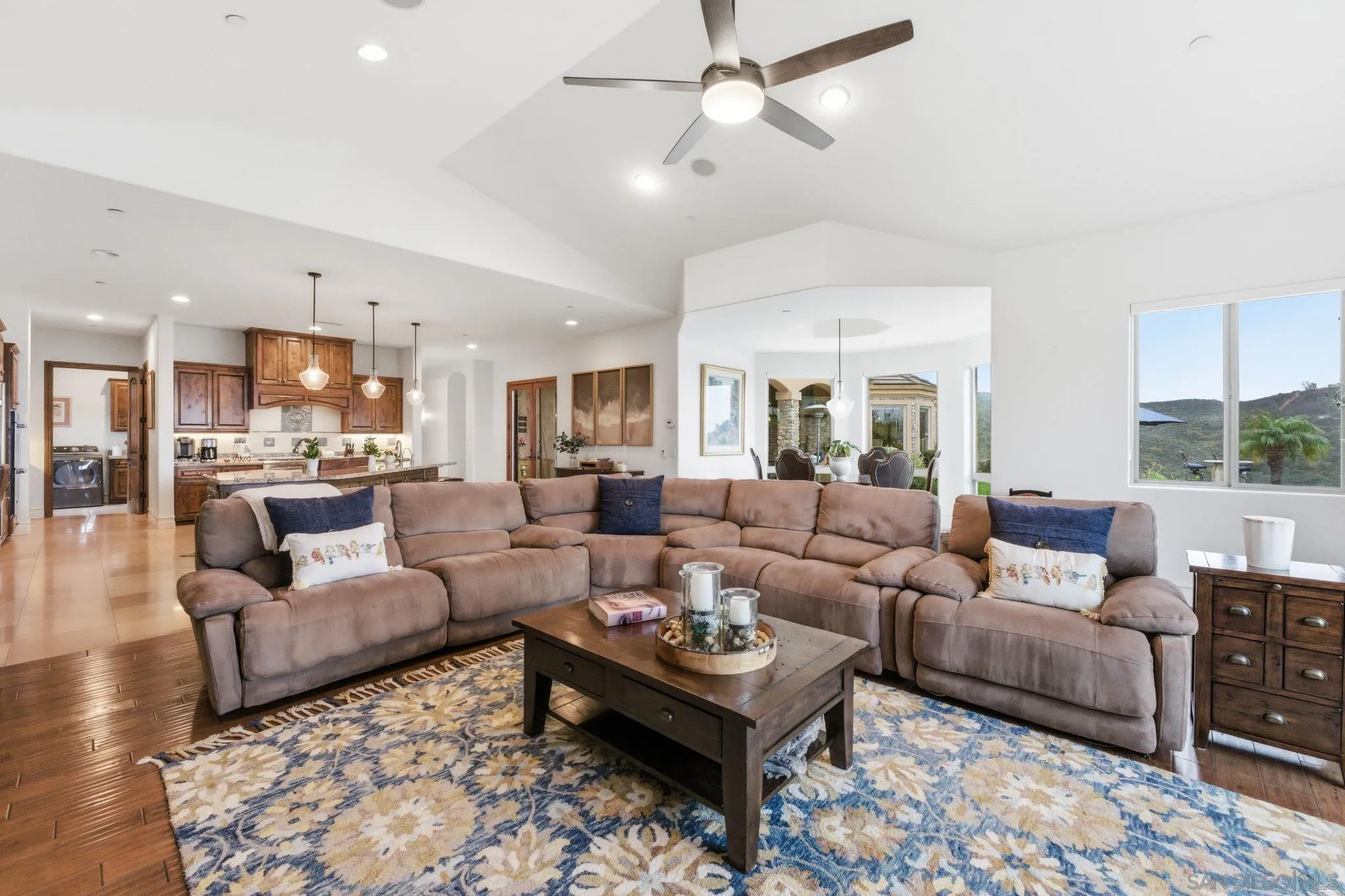 15480 Eastvale Road Poway, CA 92064 - Photo 34 of 71 a living room with furniture and view of kitchen