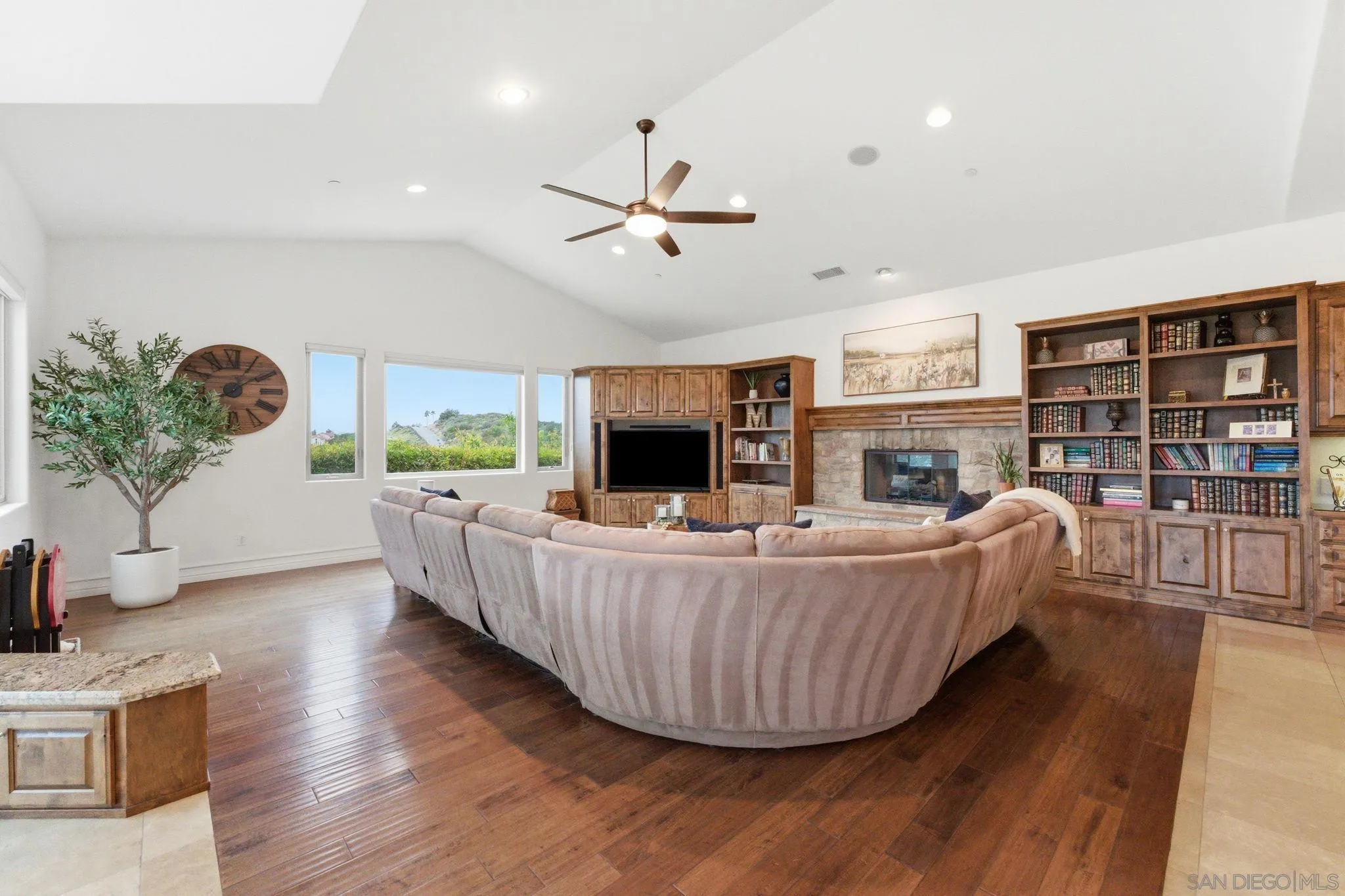 15480 Eastvale Road Poway, CA 92064 - Photo 37 of 71 a living room with furniture and a fireplace