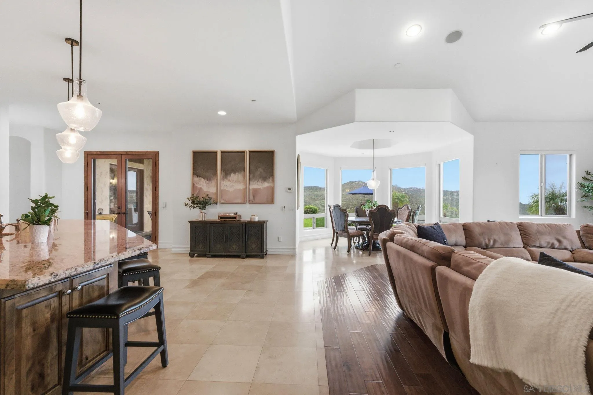 15480 Eastvale Road Poway, CA 92064 - Photo 38 of 71 a living room with furniture a table and chairs
