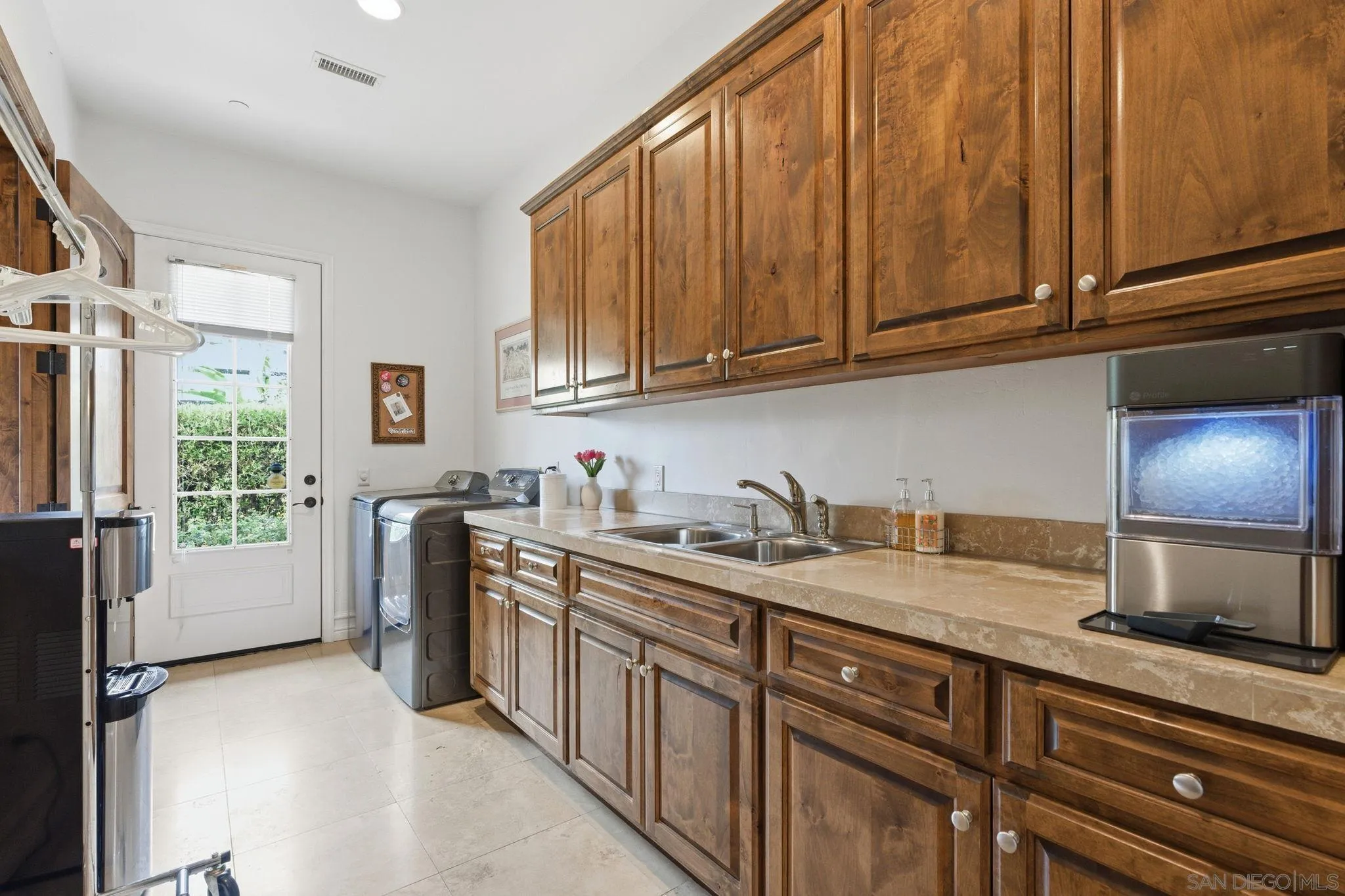 15480 Eastvale Road Poway, CA 92064 - Photo 49 of 71 a kitchen with stainless steel appliances granite countertop a sink stove and refrigerator