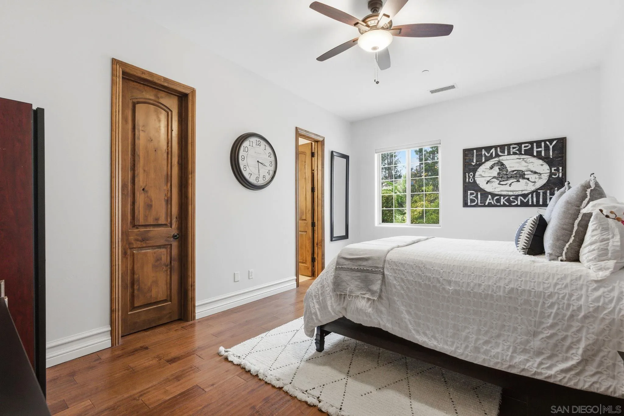 15480 Eastvale Road Poway, CA 92064 - Photo 60 of 71 a bedroom with a bed and a window