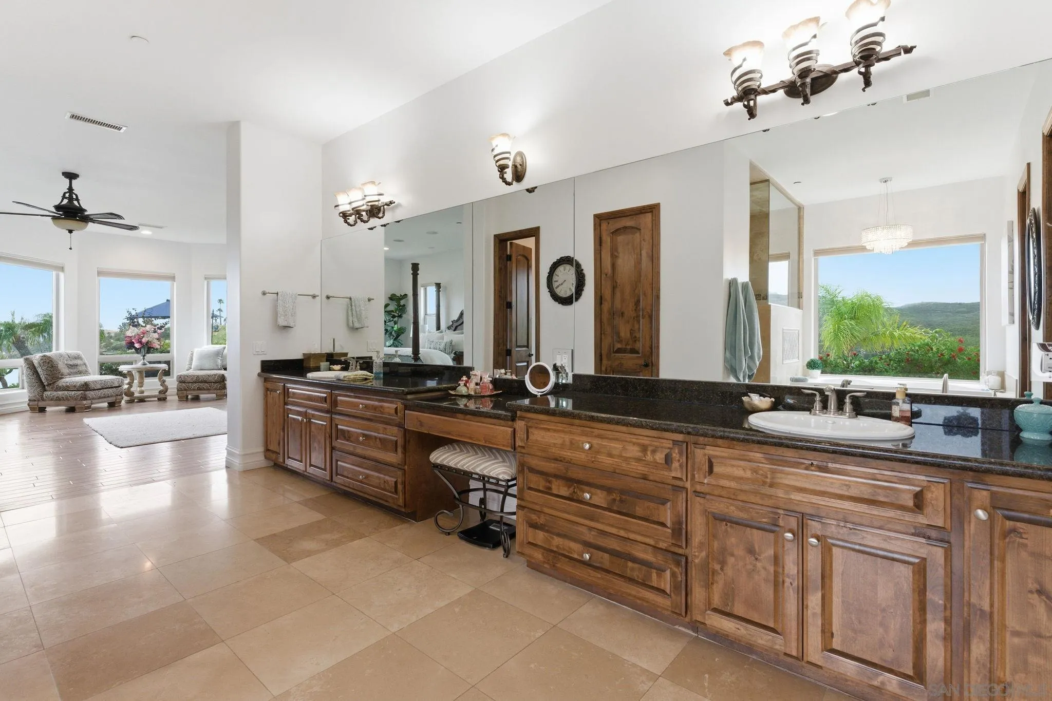 15480 Eastvale Road Poway, CA 92064 - Photo 62 of 71 a large bathroom with a large tub sink and large mirror