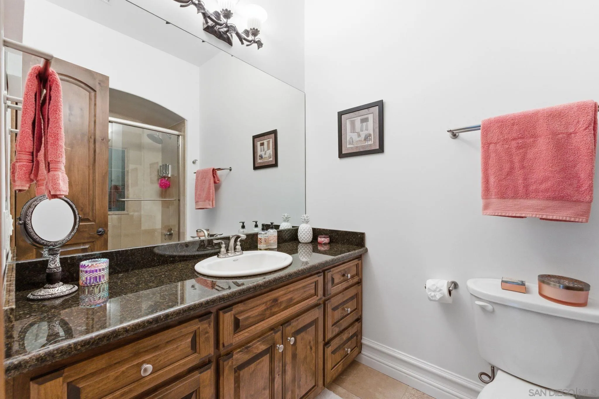 15480 Eastvale Road Poway, CA 92064 - Photo 65 of 71 a bathroom with a sink and a mirror