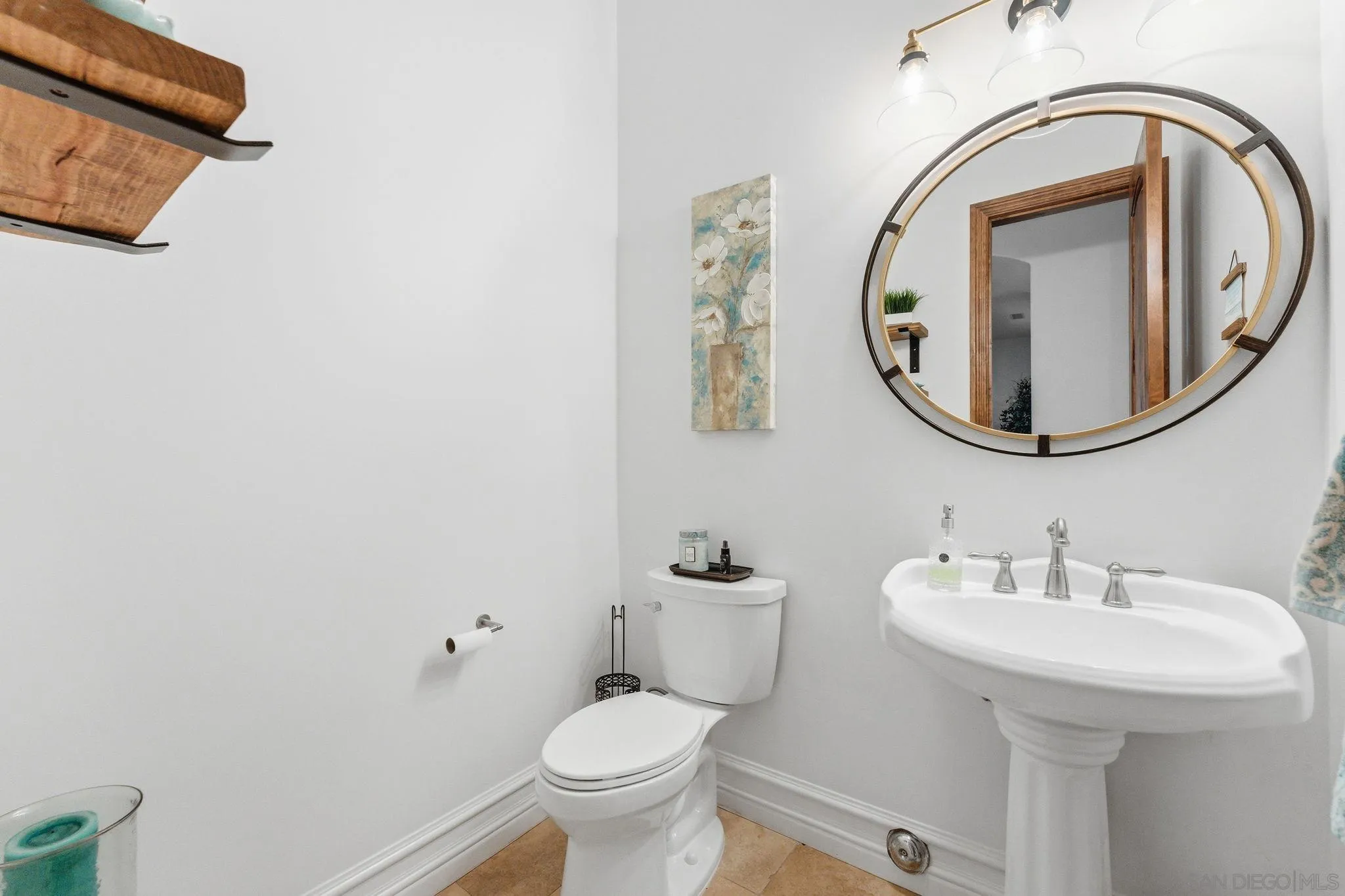15480 Eastvale Road Poway, CA 92064 - Photo 67 of 71 a bathroom with a toilet sink and mirror