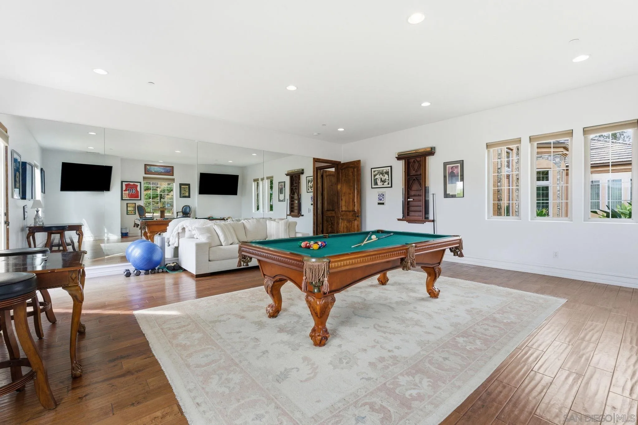 15480 Eastvale Road Poway, CA 92064 - Photo 68 of 71 a living room with furniture and a flat screen tv