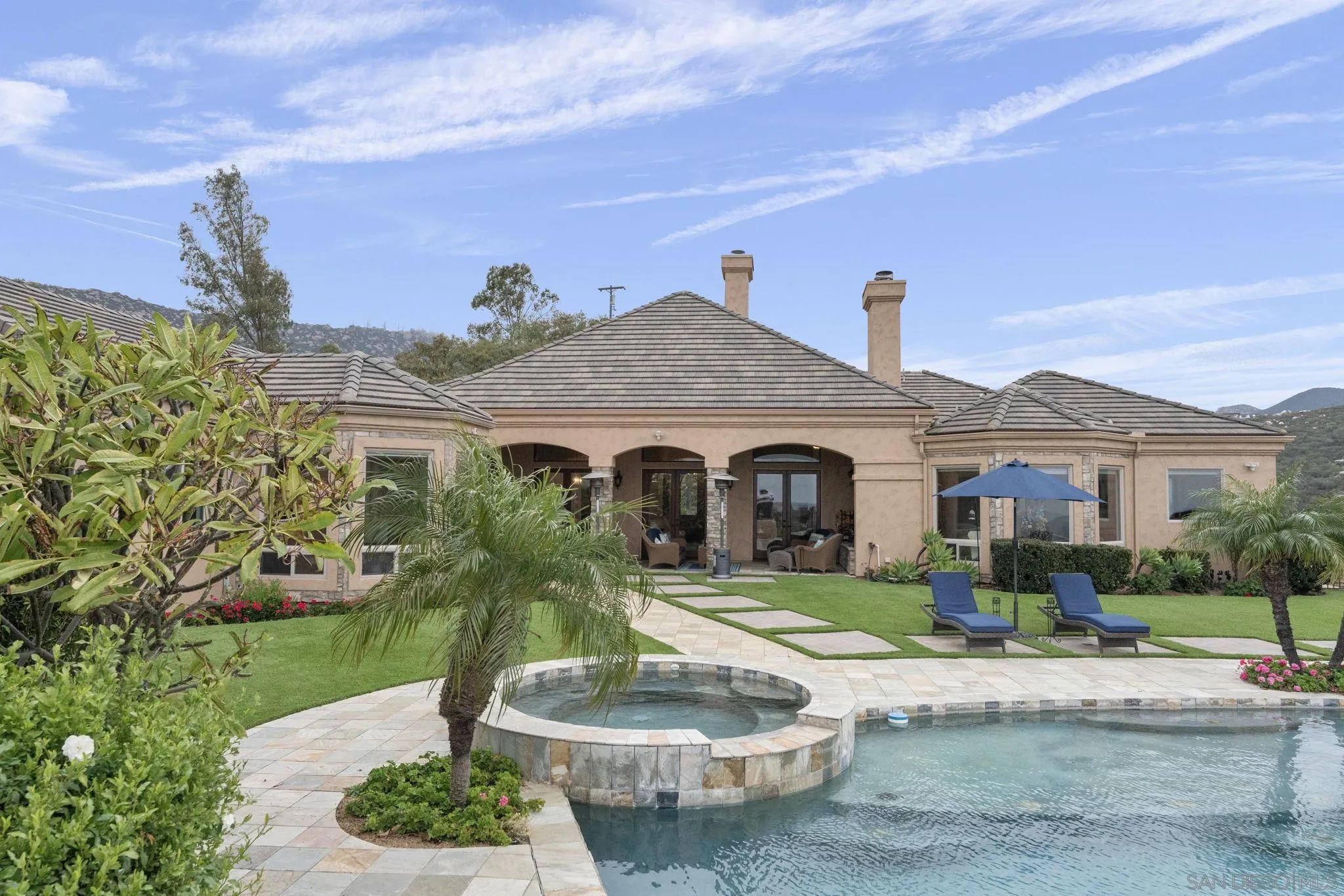 15480 Eastvale Road Poway, CA 92064 - Photo 10 of 71 a front view of a house with a yard