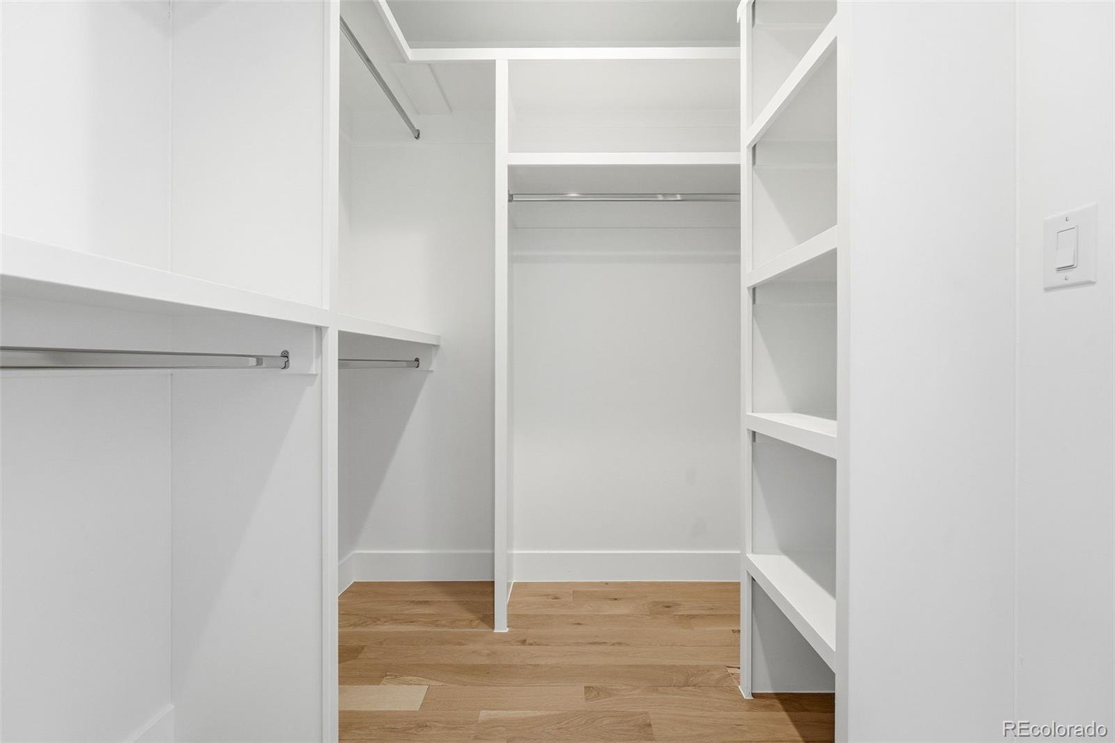 2186 South Sherman Street Denver, CO 80210 - Photo 21 of 44 a view of walk in closet with empty racks