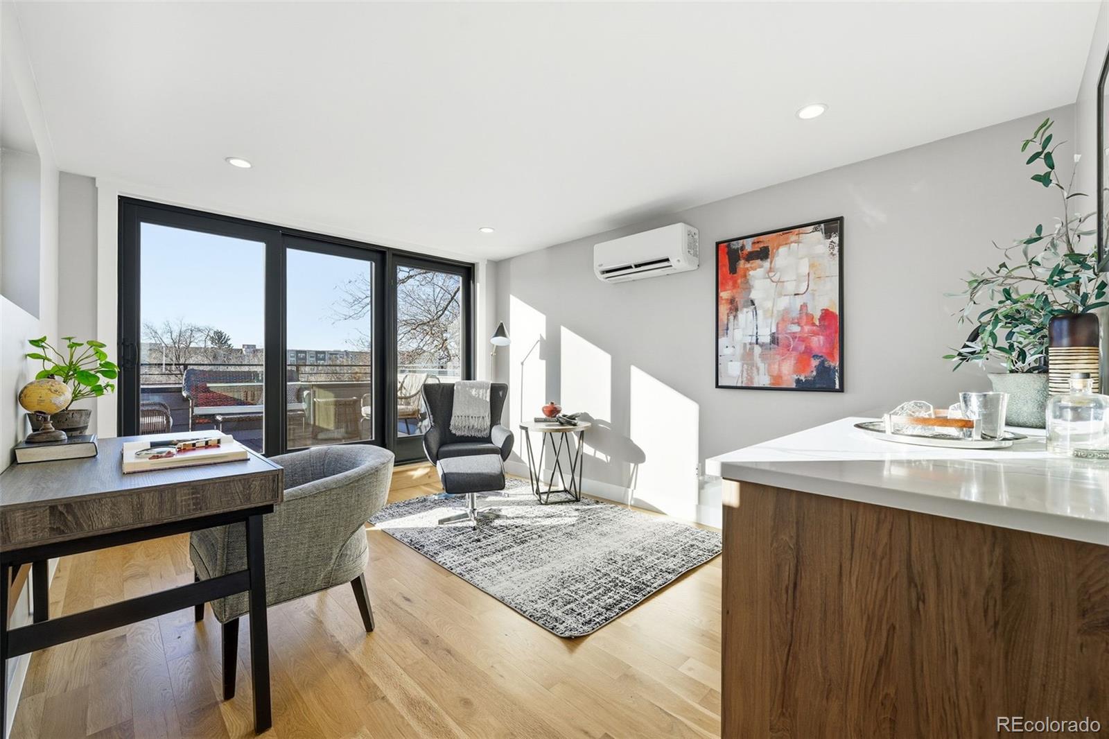 2186 South Sherman Street Denver, CO 80210 - Photo 23 of 44 a living room with furniture and a potted plant