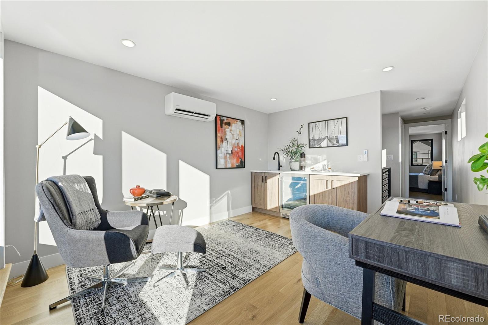 2186 South Sherman Street Denver, CO 80210 - Photo 24 of 44 a living room with furniture and kitchen view
