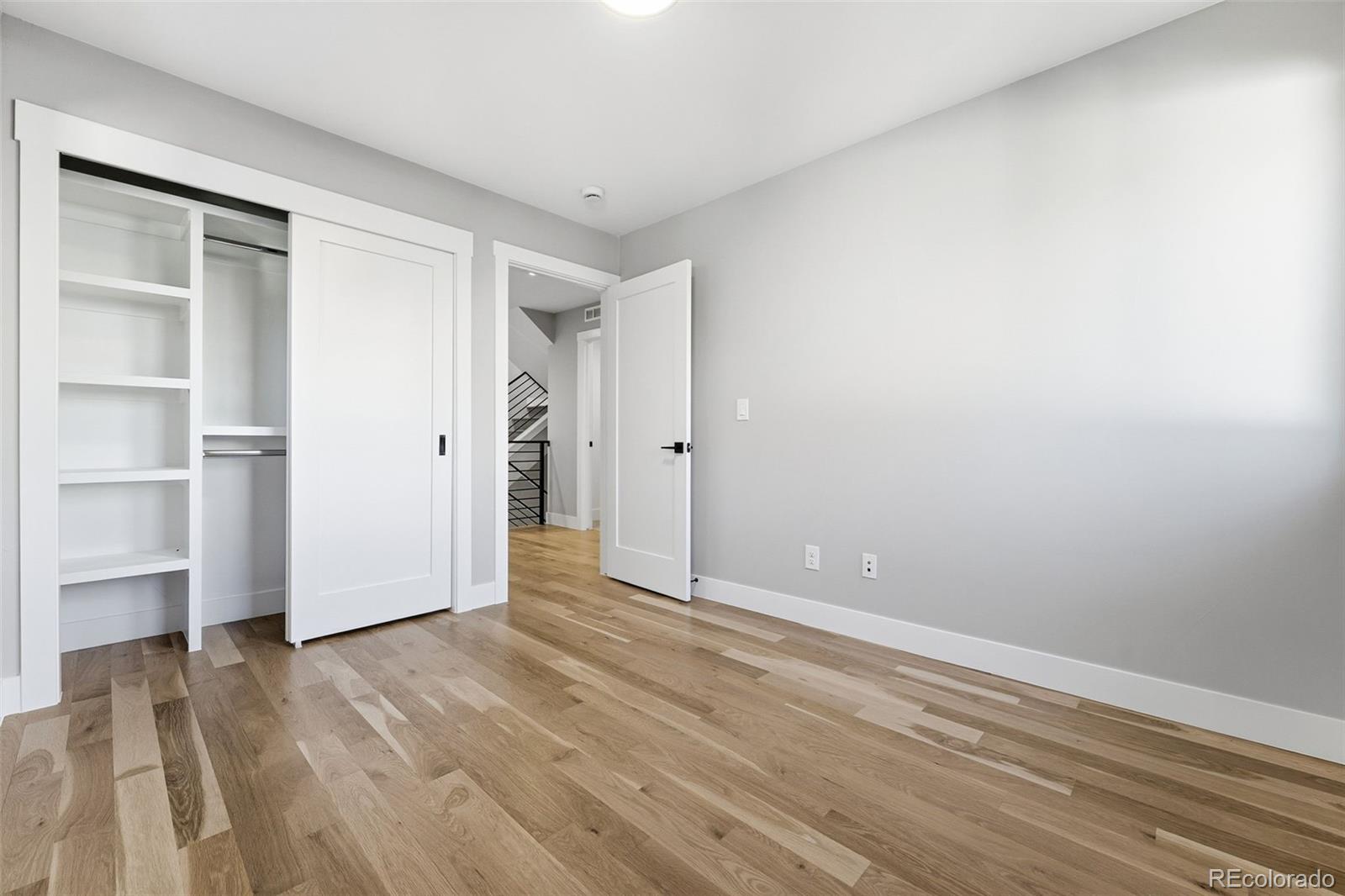 2186 South Sherman Street Denver, CO 80210 - Photo 34 of 44 a view of empty room with wooden floor and window