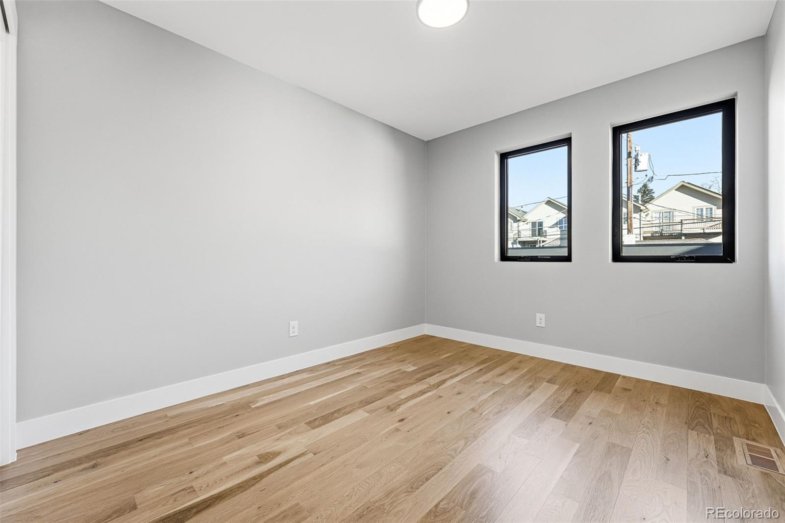 2186 South Sherman Street Denver, CO 80210 - Photo 35 of 44 a view of empty room with wooden floor