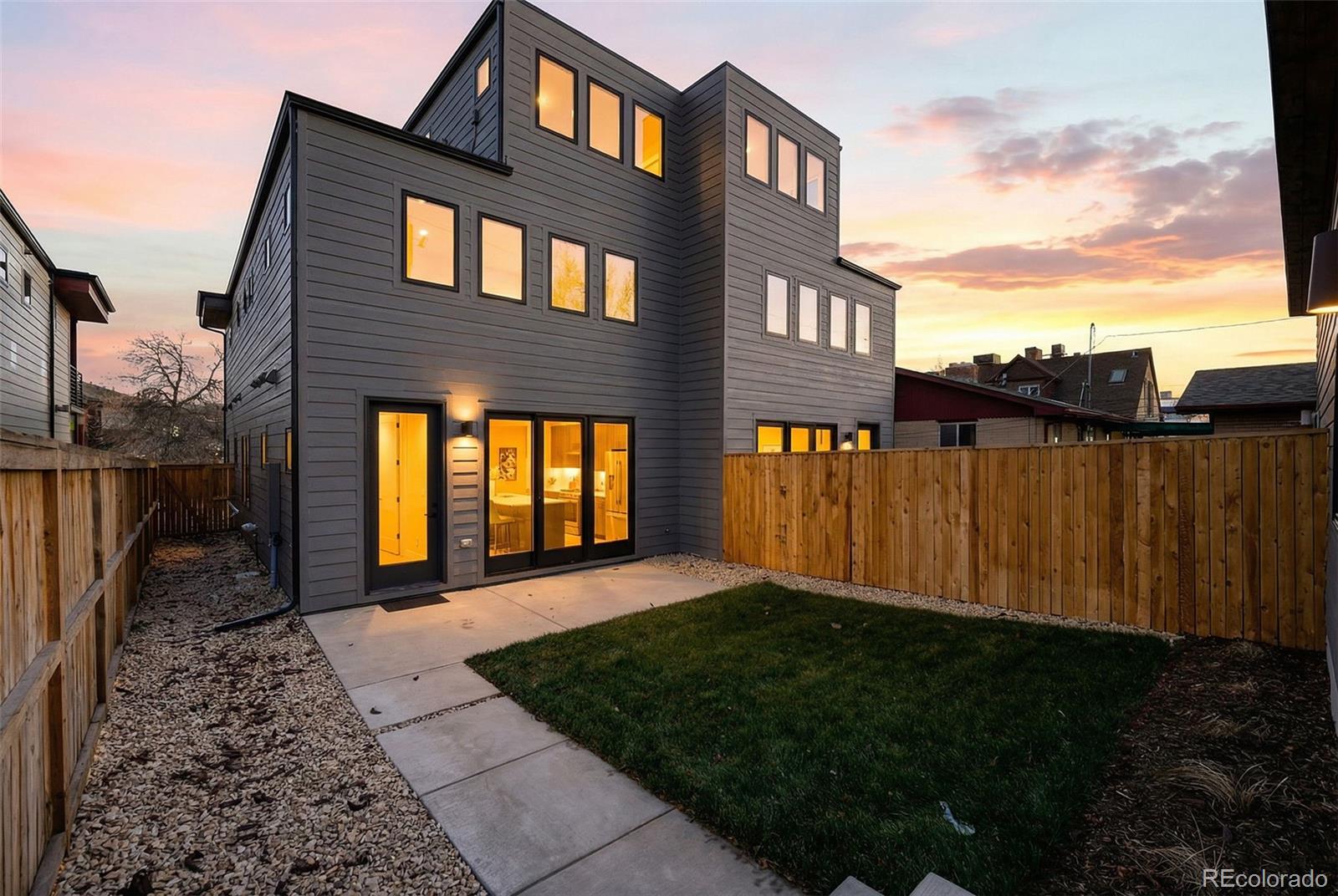 2186 South Sherman Street Denver, CO 80210 - Photo 39 of 44 a front view of a house with a yard