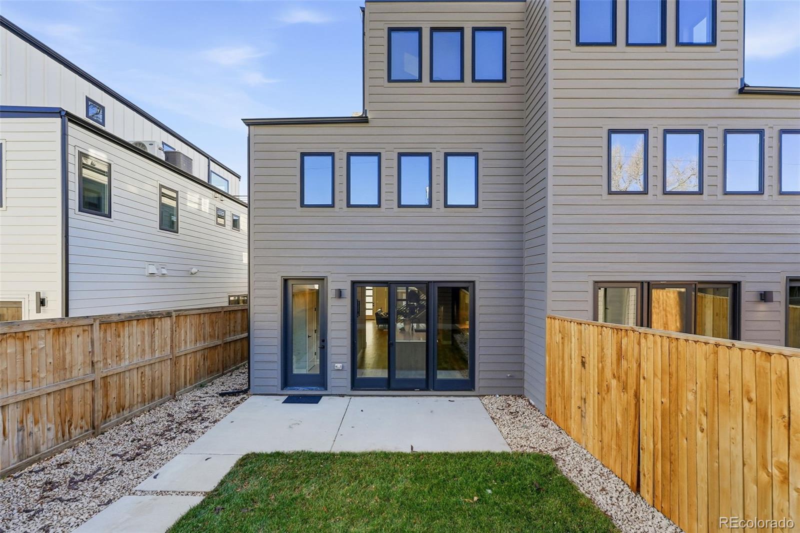 2186 South Sherman Street Denver, CO 80210 - Photo 42 of 44 a view of brick house with a yard
