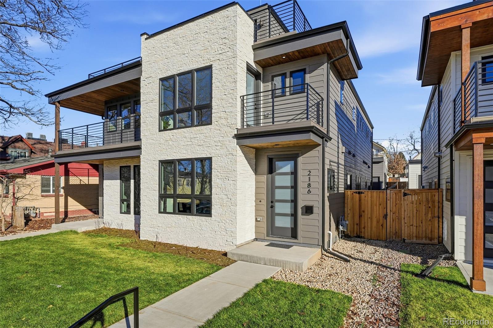 2186 South Sherman Street Denver, CO 80210 - Photo 44 of 44 a view of a house with a porch and furniture