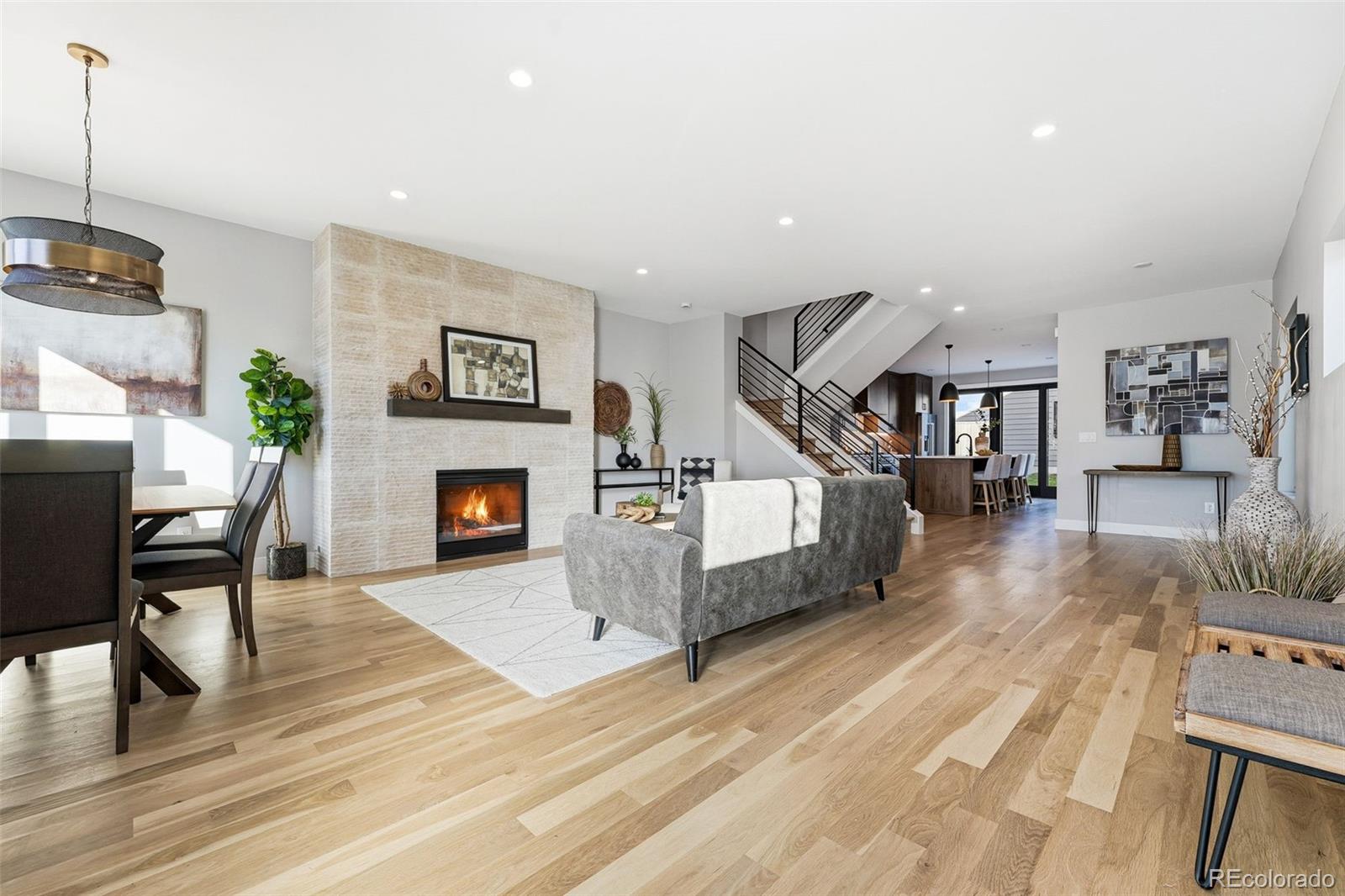 2186 South Sherman Street Denver, CO 80210 - Photo 5 of 44 a living room with furniture and a fireplace