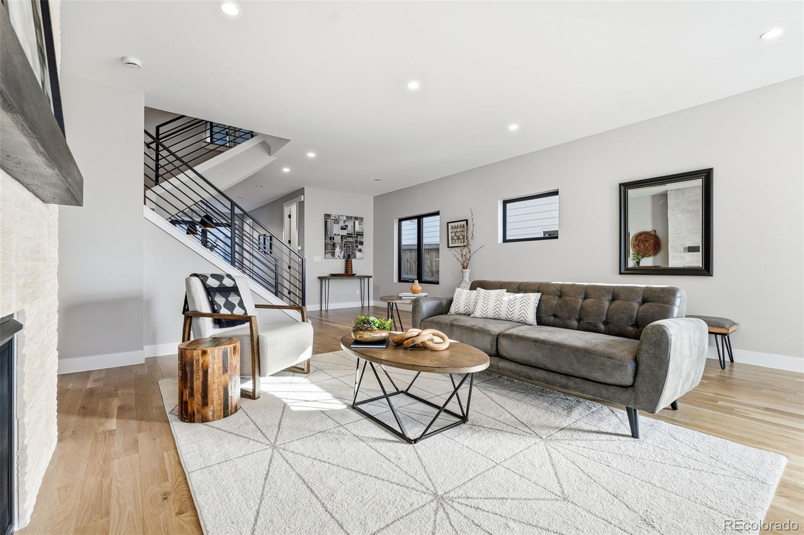 2186 South Sherman Street Denver, CO 80210 - Photo 6 of 44 a living room with furniture and wooden floor