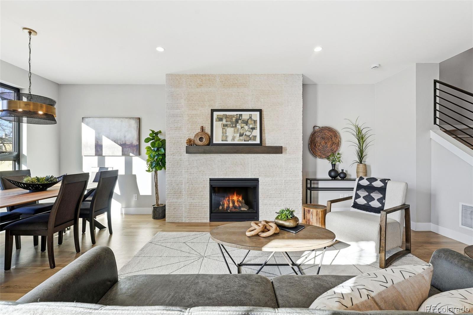 2186 South Sherman Street Denver, CO 80210 - Photo 7 of 44 a living room with furniture and a fireplace
