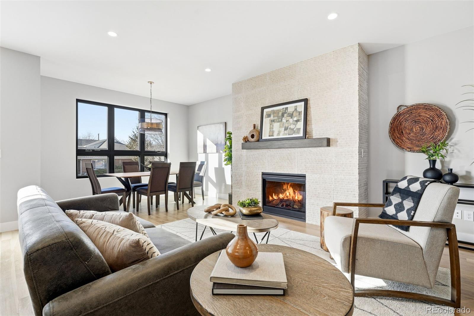 2186 South Sherman Street Denver, CO 80210 - Photo 8 of 44 a living room with furniture and a fireplace