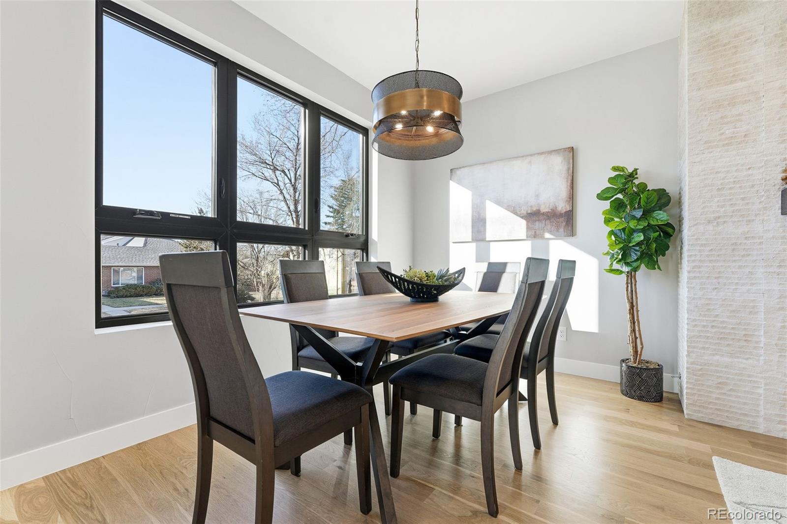 2186 South Sherman Street Denver, CO 80210 - Photo 10 of 44 a view of a dining room with furniture window and wooden floor