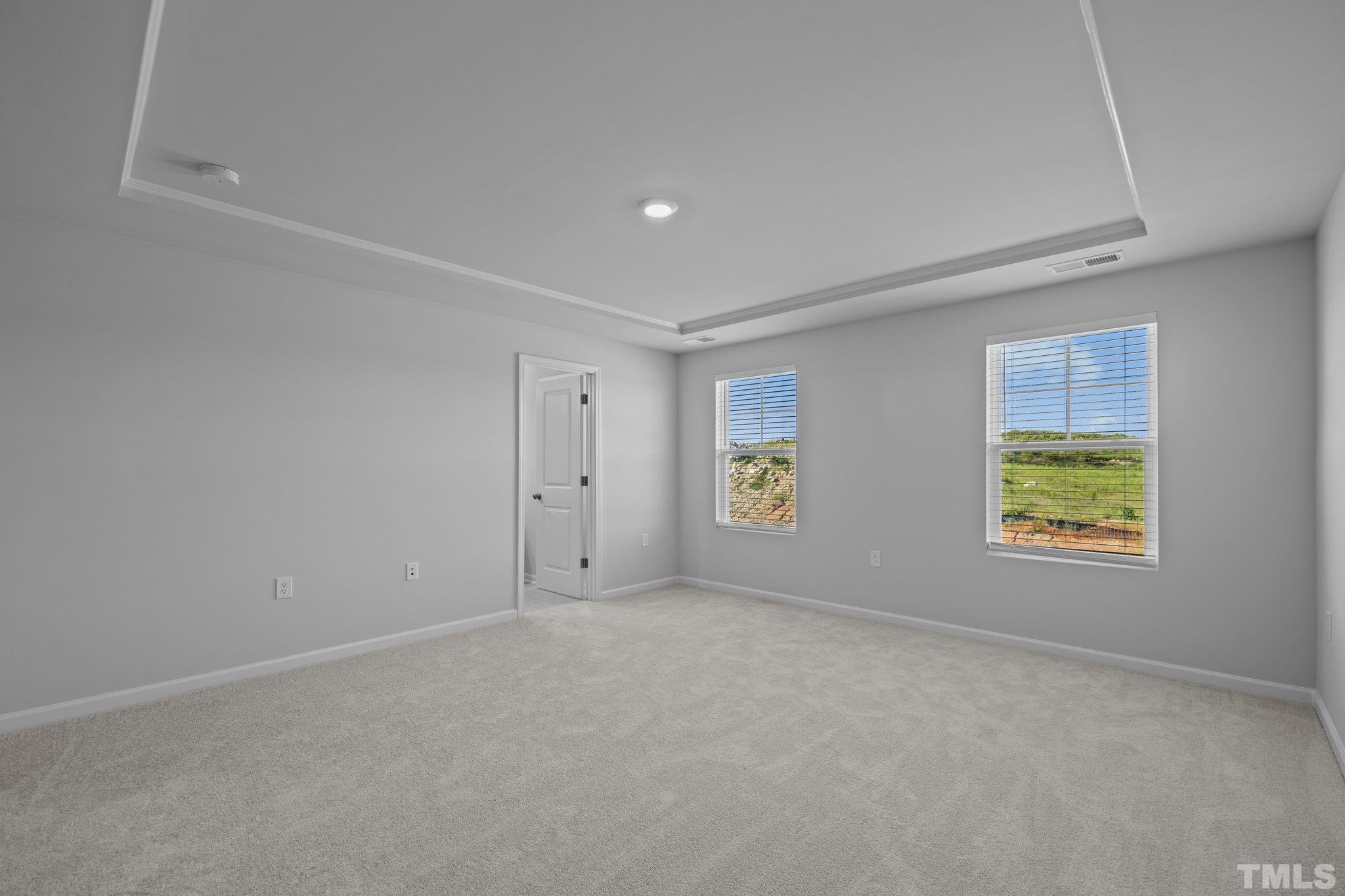 5106 Anamosa Street Raleigh, NC 27610 - Photo 12 of 49 an empty room with windows