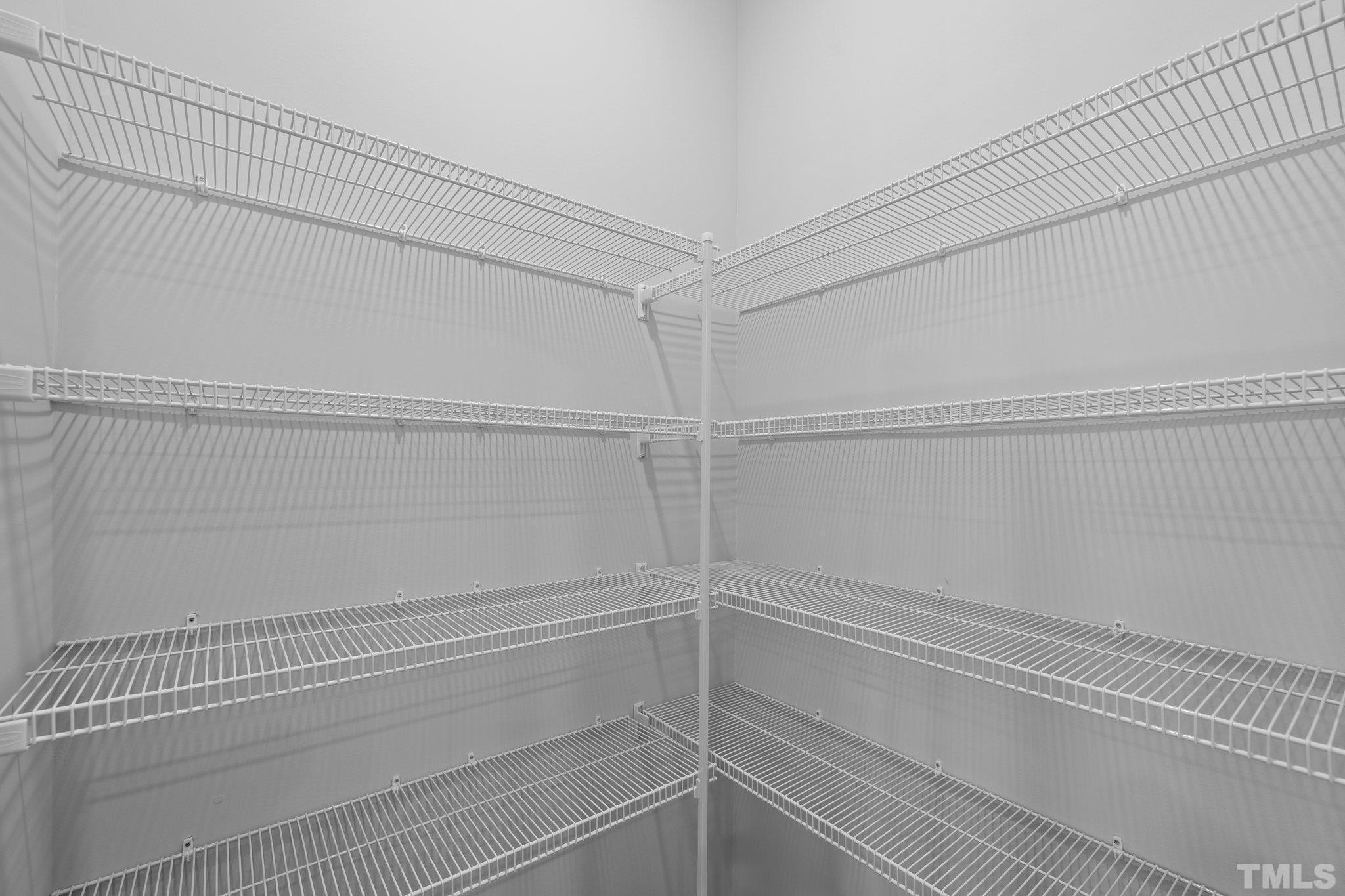 5106 Anamosa Street Raleigh, NC 27610 - Photo 23 of 49 a view of a room with racks on the wall