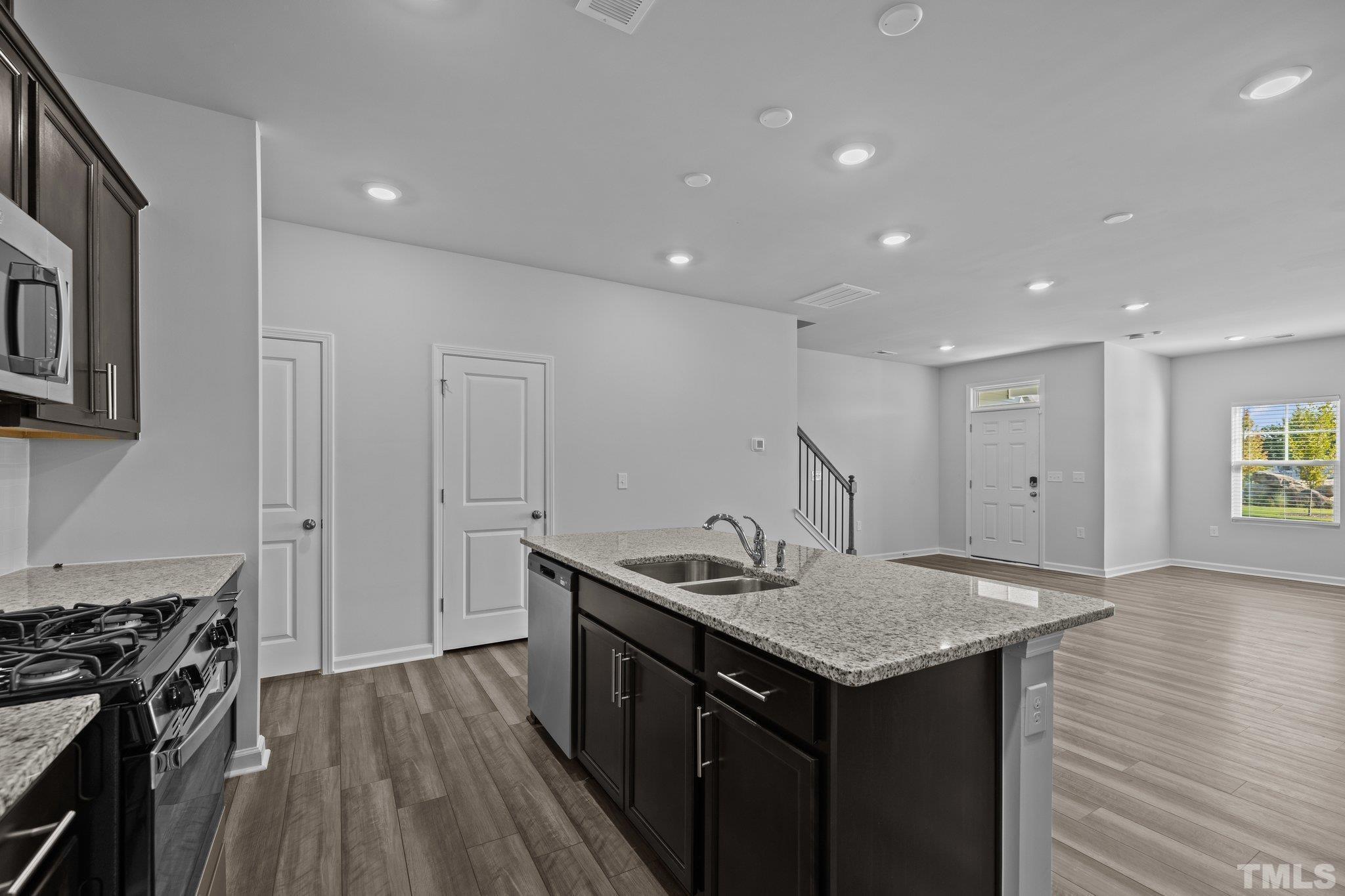 5106 Anamosa Street Raleigh, NC 27610 - Photo 24 of 49 a kitchen that has a lot of cabinets in it