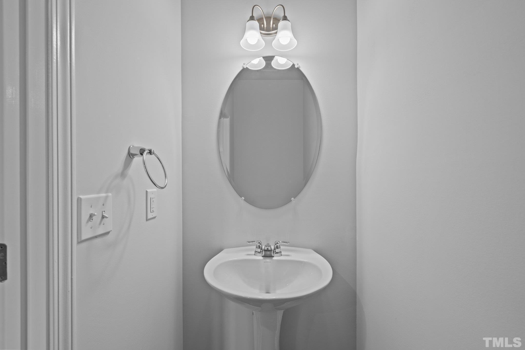 5106 Anamosa Street Raleigh, NC 27610 - Photo 25 of 49 a bathroom with a sink and a mirror