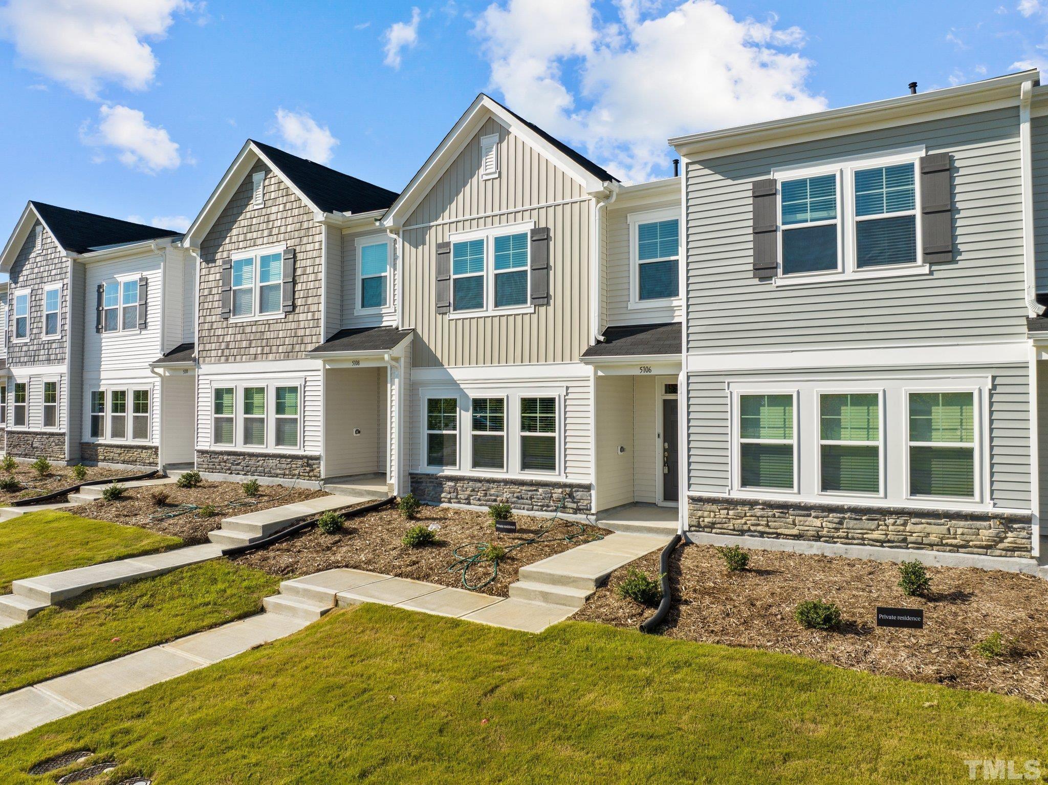 5106 Anamosa Street Raleigh, NC 27610 - Photo 28 of 49 a front view of a house with yard and porch