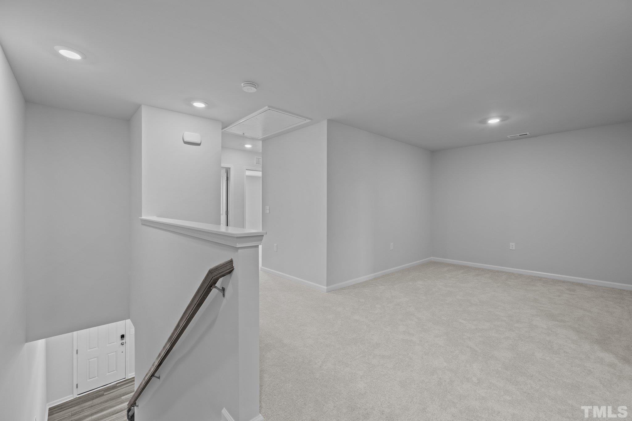 5106 Anamosa Street Raleigh, NC 27610 - Photo 4 of 49 wooden floor in an empty room with a window