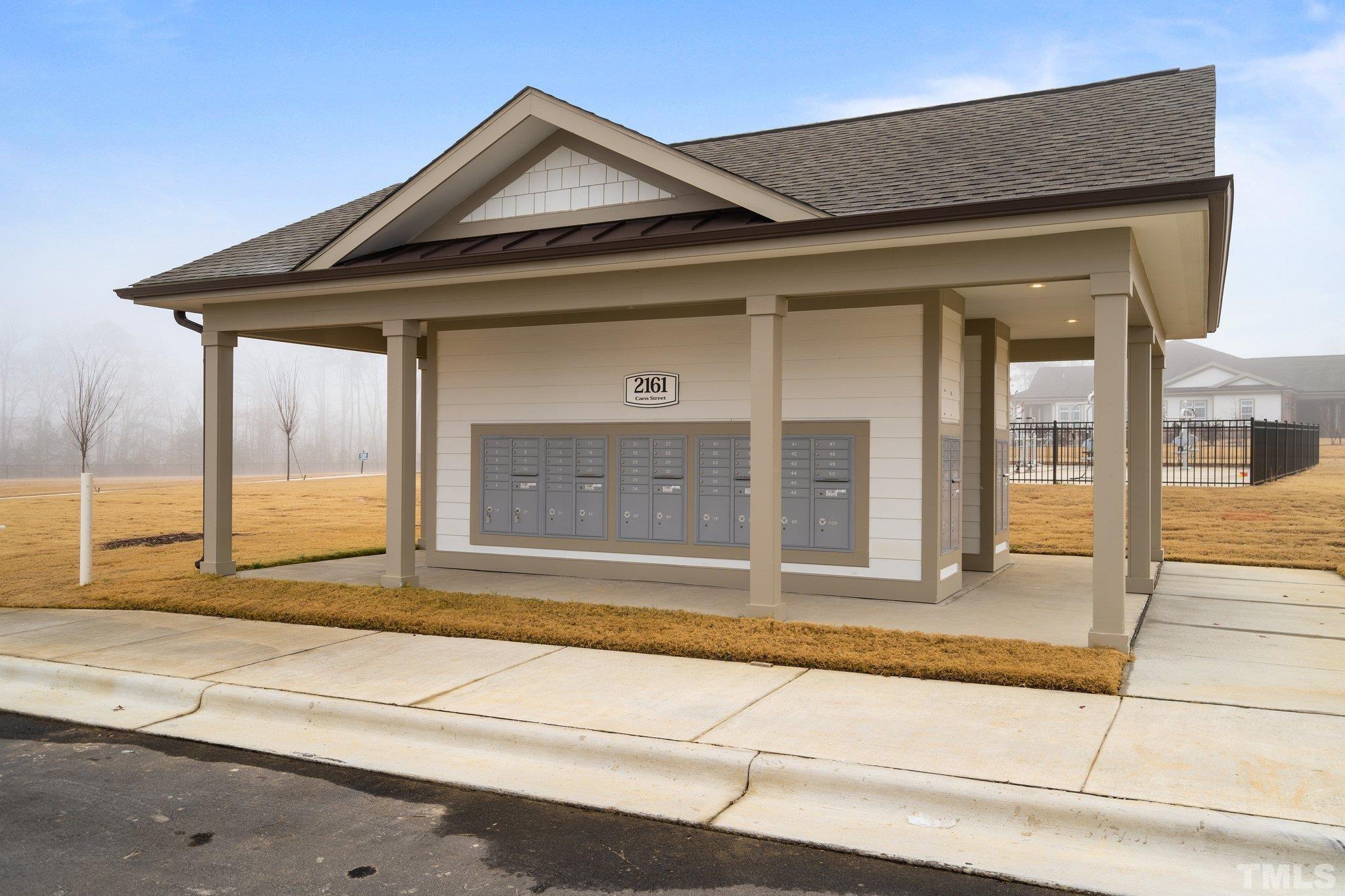 5106 Anamosa Street Raleigh, NC 27610 - Photo 43 of 49 a view of a brick house with a large windows