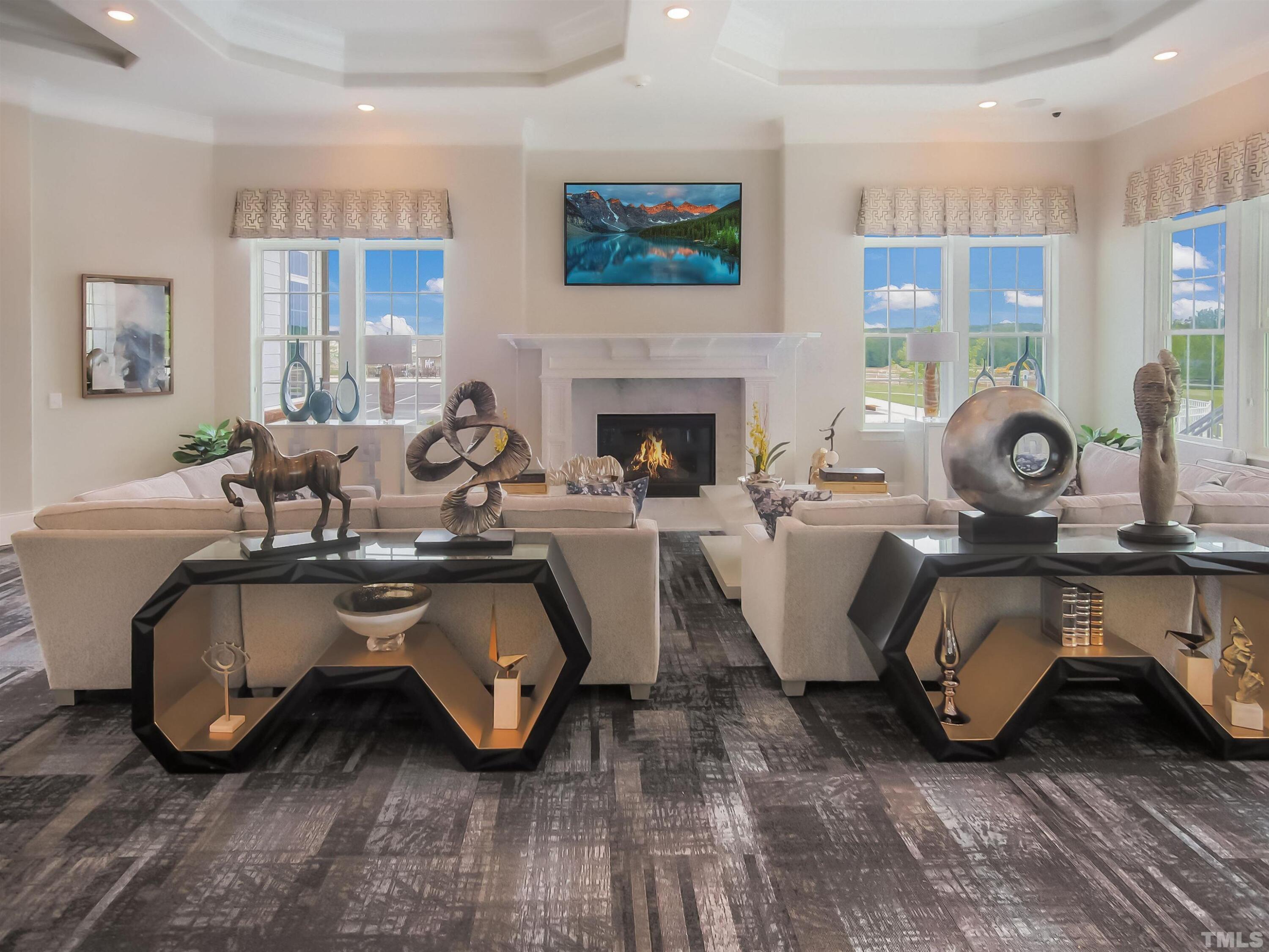 5106 Anamosa Street Raleigh, NC 27610 - Photo 48 of 49 a living room with furniture a fireplace and wooden floor