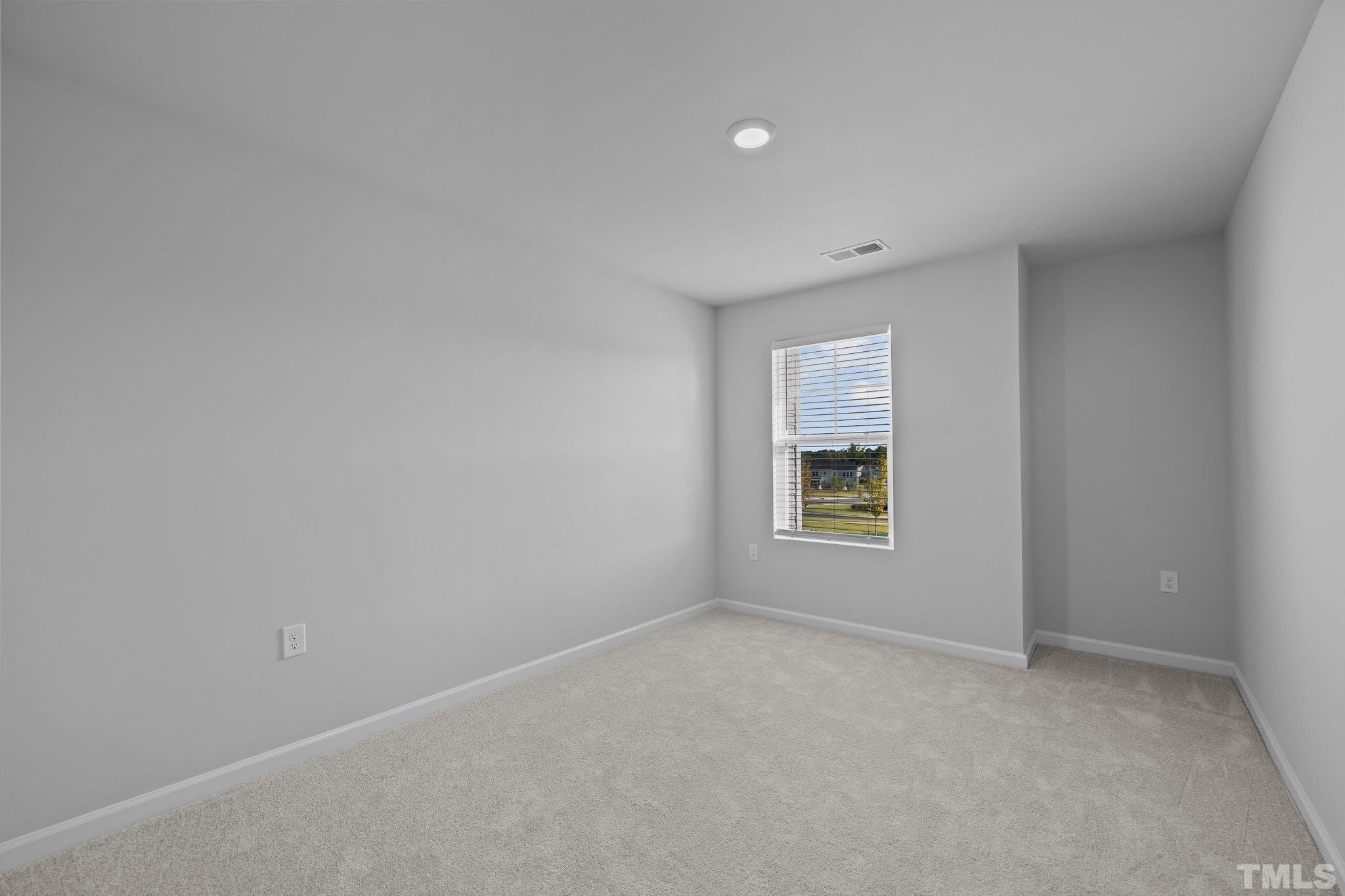5106 Anamosa Street Raleigh, NC 27610 - Photo 7 of 49 a view of an empty room with a window