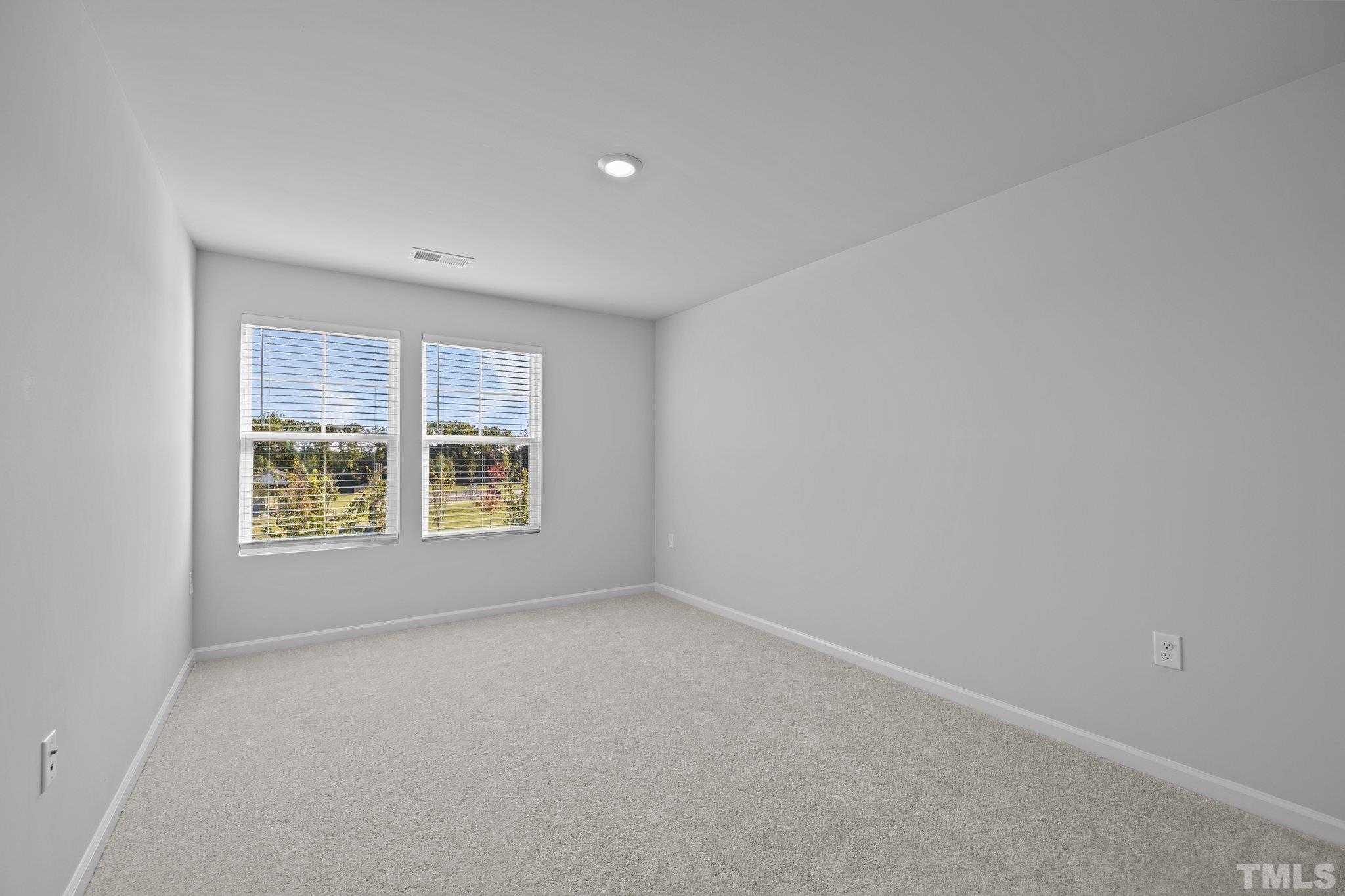 5106 Anamosa Street Raleigh, NC 27610 - Photo 10 of 49 an empty room with windows