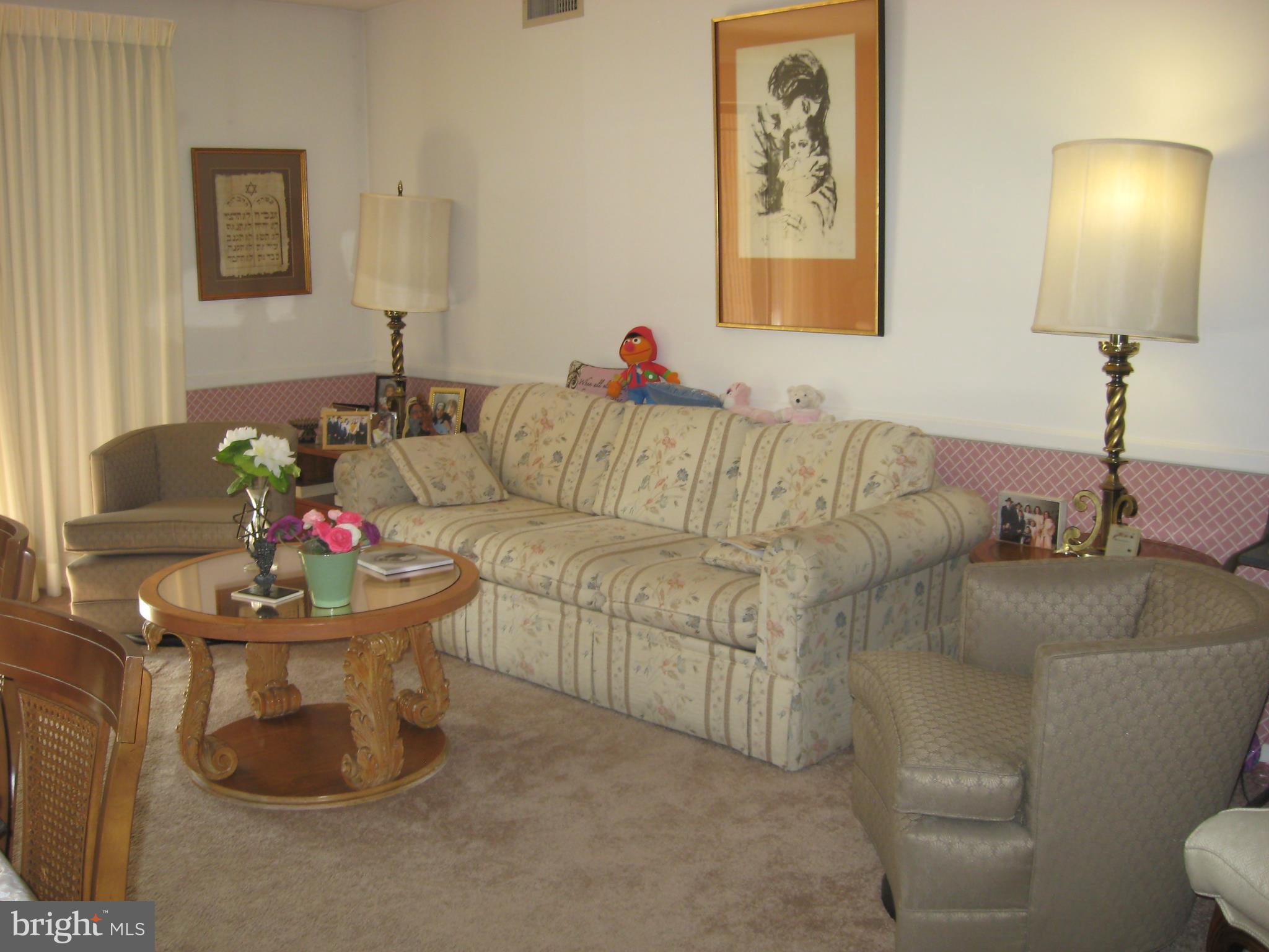 2901 Fallstaff Road, Unit 107 Baltimore, MD 21209 - Photo 3 of 15 LIVING ROOM LEADS OUT TO LASRGE PATIO
