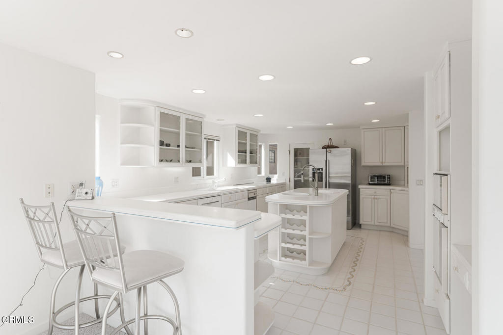 5331 Wavecrest Way Oxnard, CA 93035 - Photo 16 of 60 a kitchen with a sink and chairs