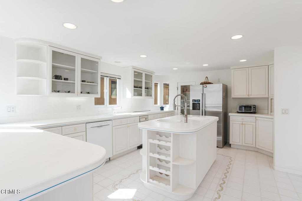 5331 Wavecrest Way Oxnard, CA 93035 - Photo 17 of 60 a kitchen with stainless steel appliances a sink stove and cabinets