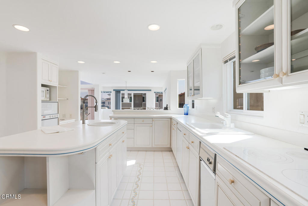 5331 Wavecrest Way Oxnard, CA 93035 - Photo 20 of 60 a large white kitchen with a sink and dishwasher