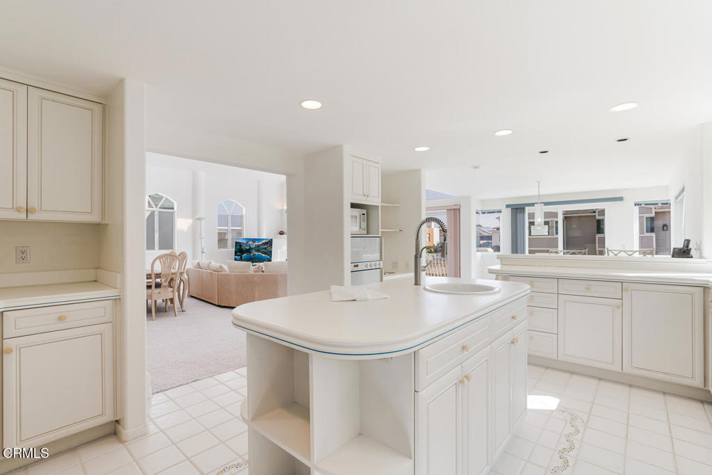 5331 Wavecrest Way Oxnard, CA 93035 - Photo 21 of 60 a kitchen with a sink and white cabinets