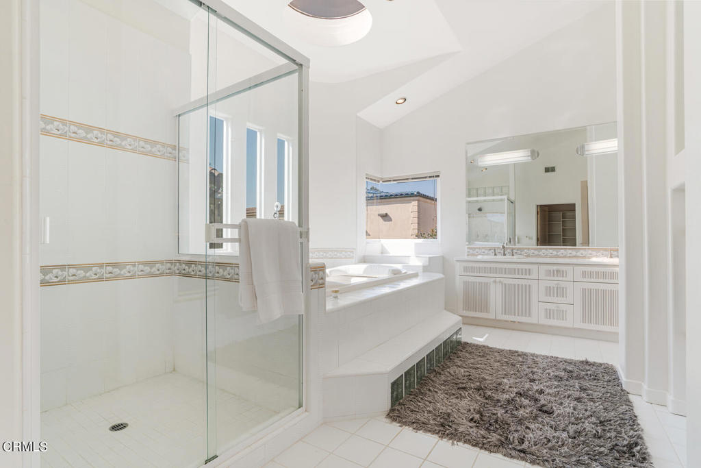5331 Wavecrest Way Oxnard, CA 93035 - Photo 27 of 60 a bathroom with a tub shower and sink