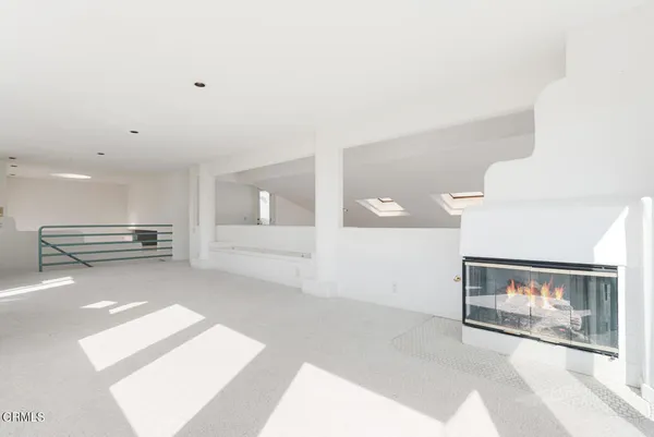 a view of entryway livingroom and hall