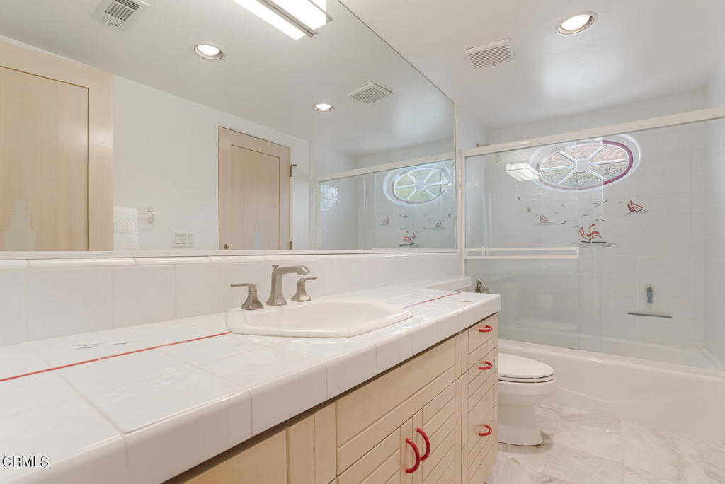 5331 Wavecrest Way Oxnard, CA 93035 - Photo 46 of 60 a bathroom with a sink a toilet and a large mirror